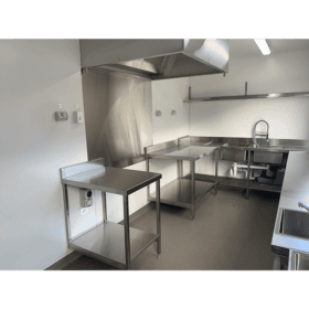 20' High Cube Modified Kitchen Container interior showing off the kitchen sinks, work bench and grease smoke trap